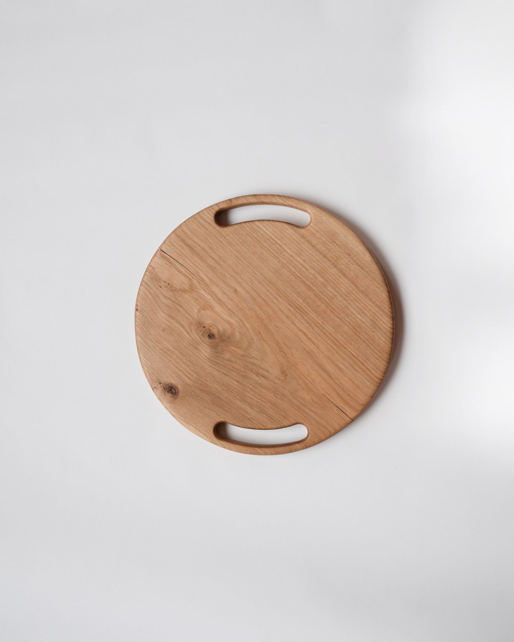 Lucas Castex No. 08 Hand-Carved Oak Wood Serving Board on light color background.