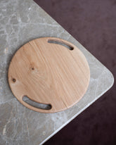 Styled image featuring the Lucas Castex No. 08 Hand-Carved Oak Wood Serving Board.