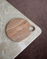 Styled image featuring the Lucas Castex No. 10 Hand-Carved Walnut Wood Serving Board.