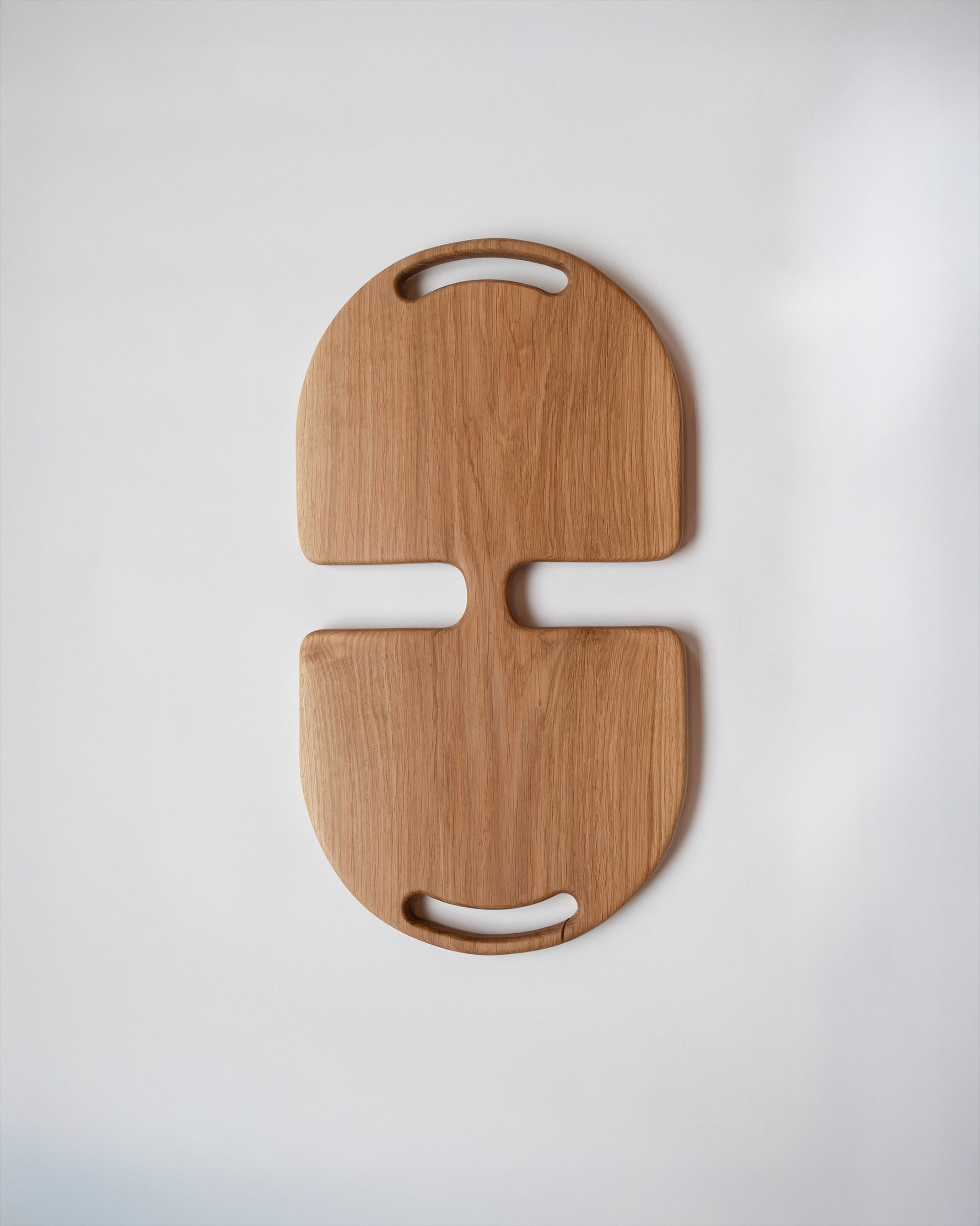 Lucas Castex No. 12 Hand-Carved Oak Wood Serving Board on light color background.