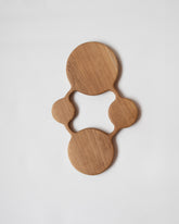 Lucas Castex No. 13 Hand-Carved Oak Wood Serving Board on light color background.