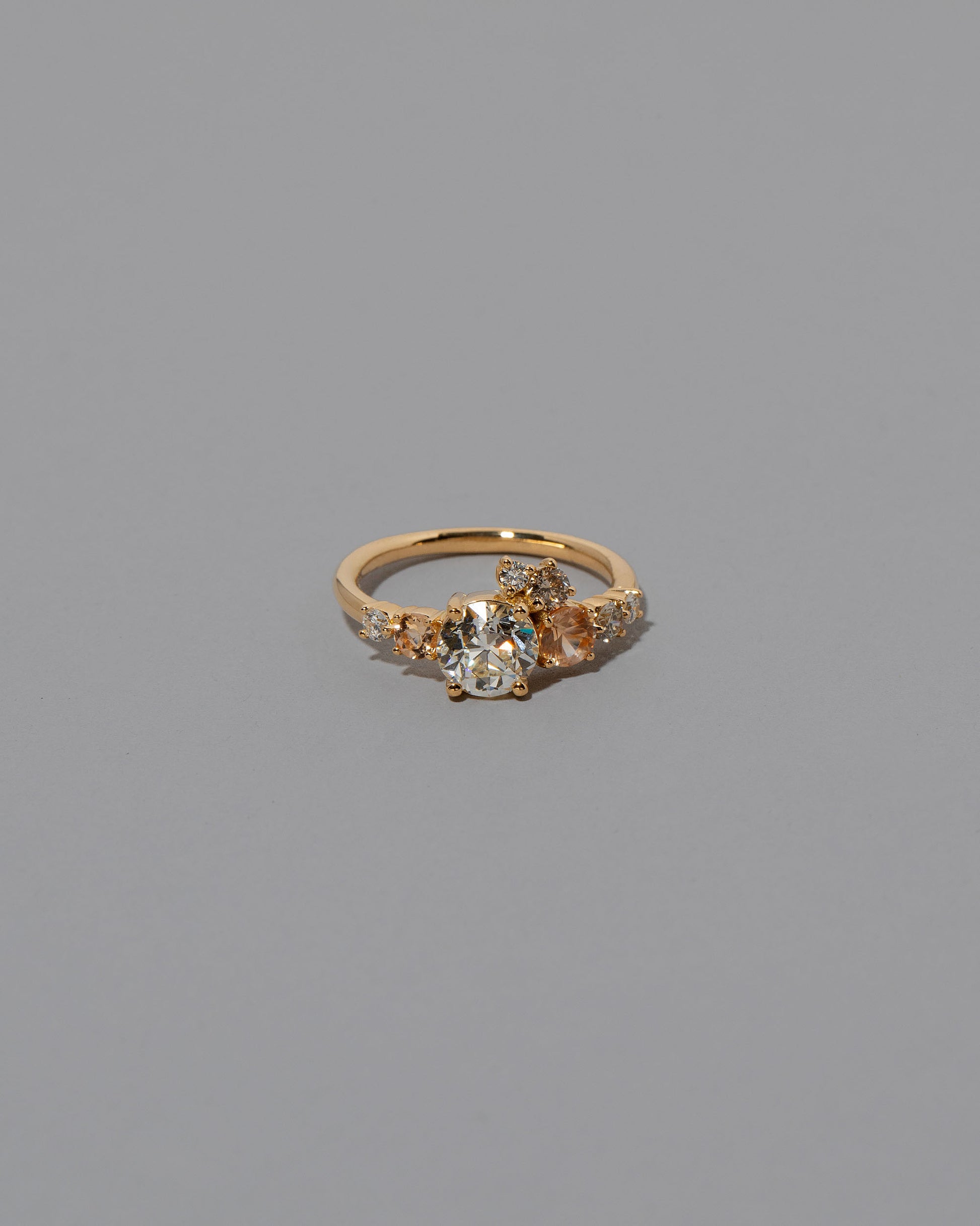 Peach Sapphire & Diamonds Luna Ring on light color background.