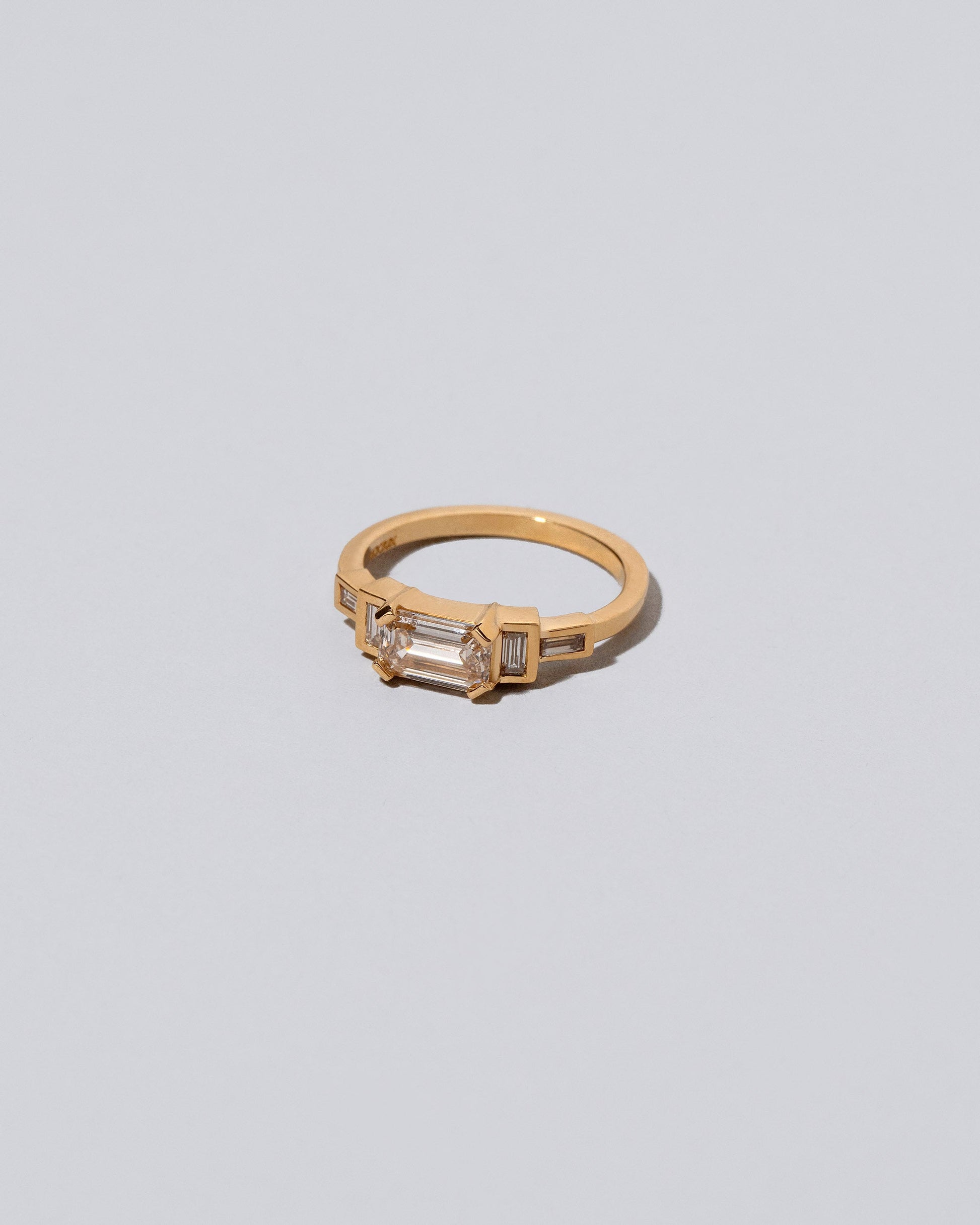 View from the side of the Champagne Diamond Expression Ring on light color background.