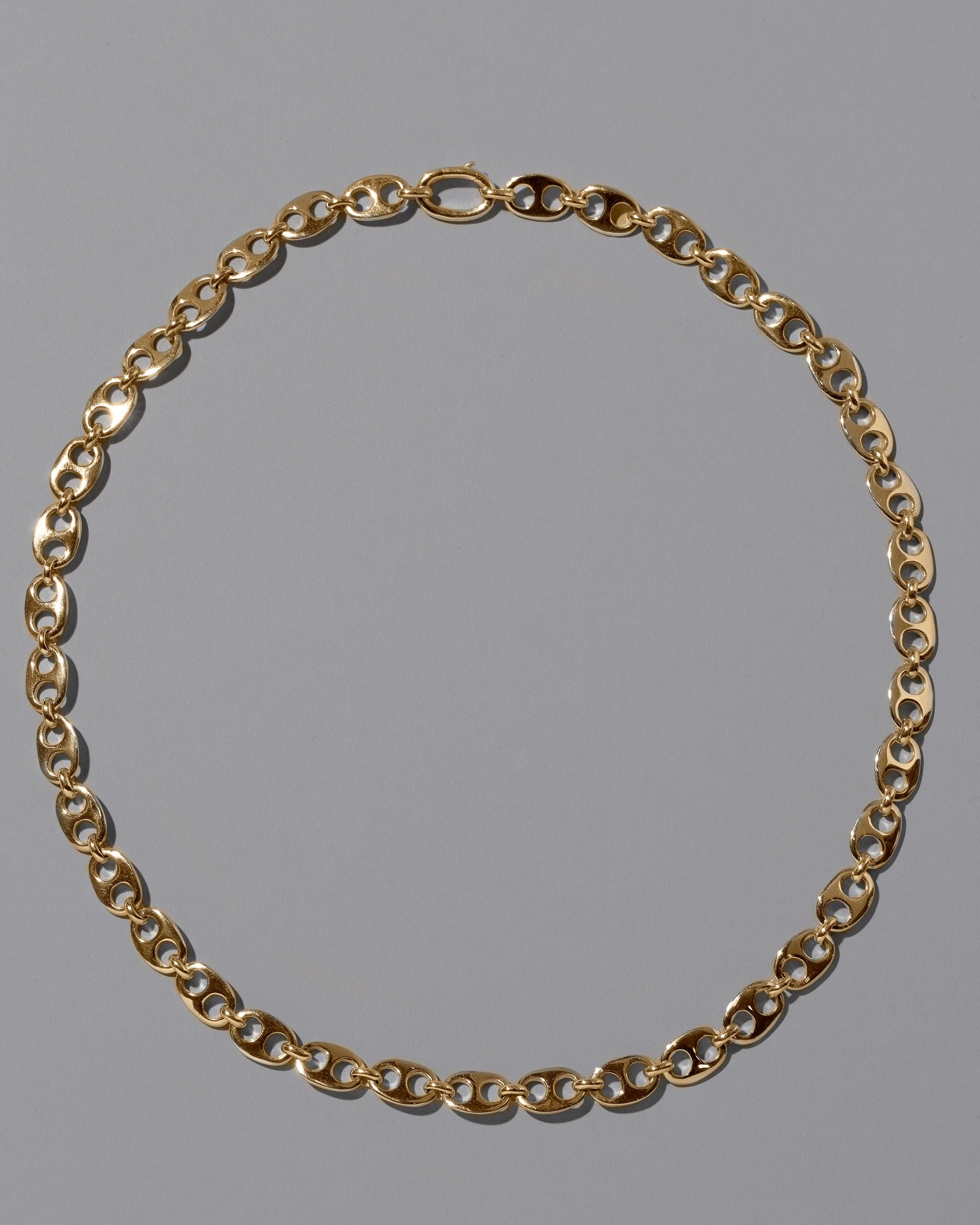 CRZM 22k Gold Yuba Mini Necklace on light color background.