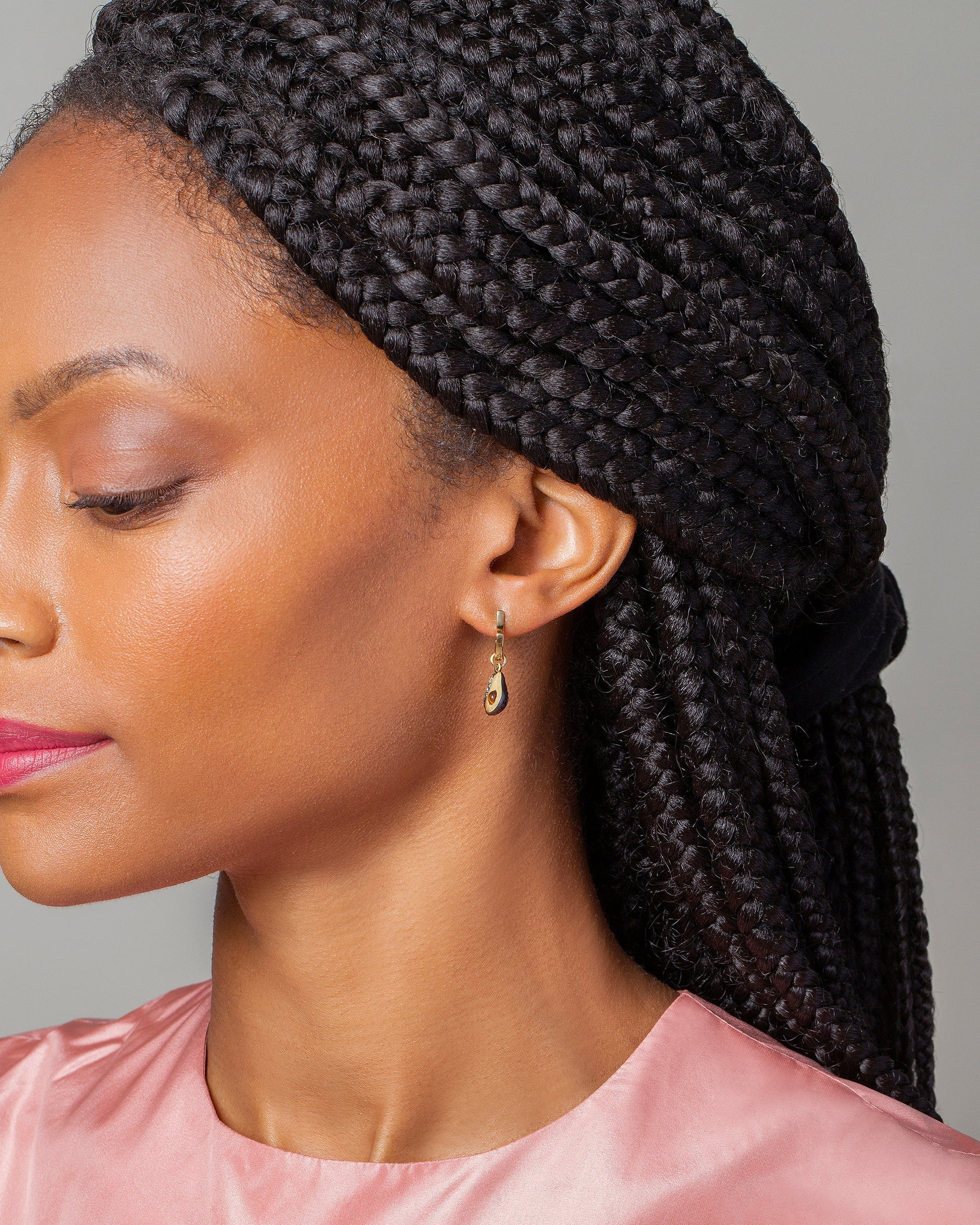 Avocado Charm and Madrone Flower Bud Hoop Earrings on model.