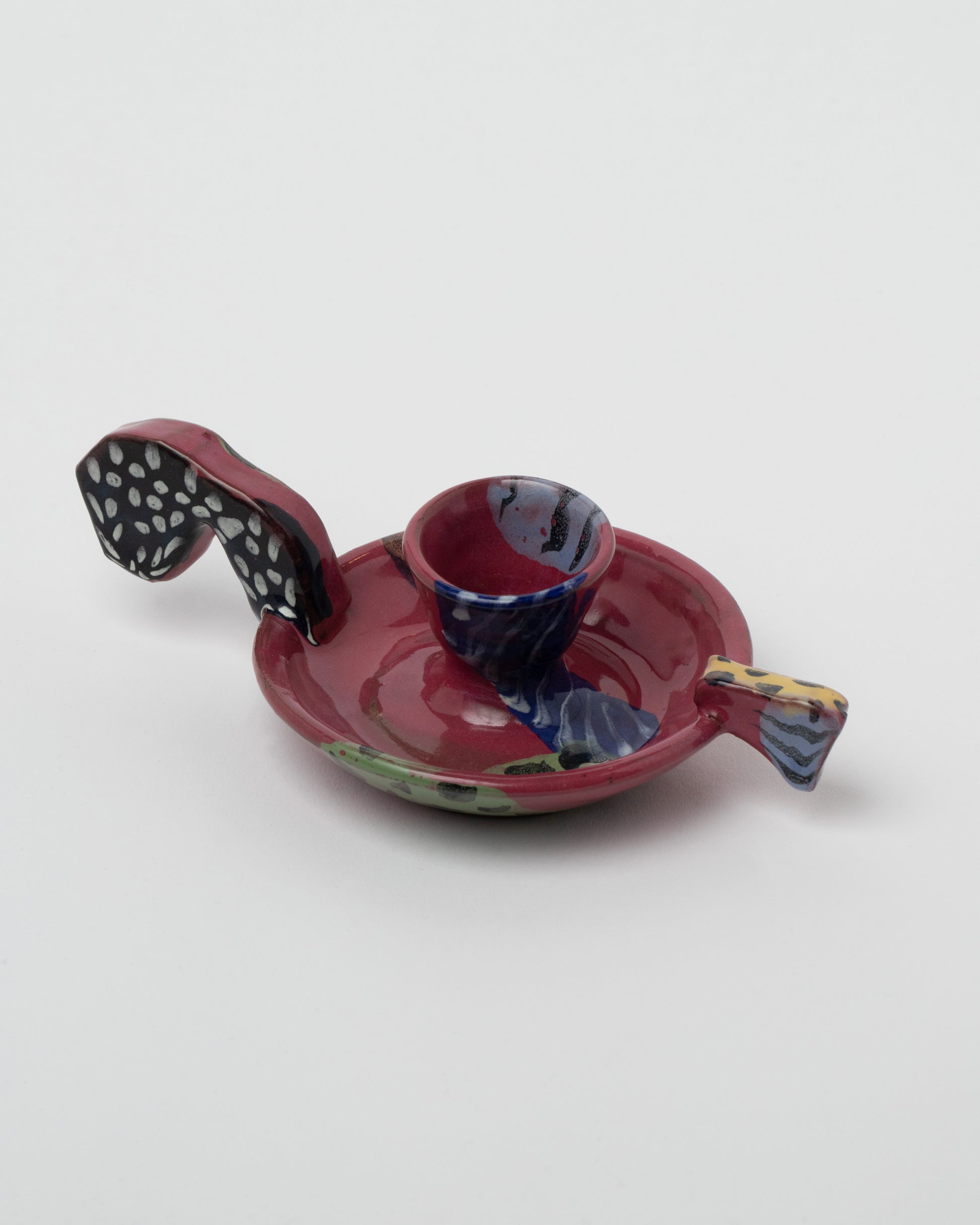 Closeup details of the Maggie Boyd Candle Holder With Short Handle on light color background.