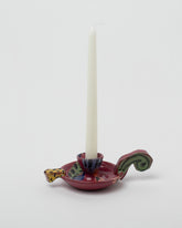 Detail view of the Maggie Boyd Candle Holder With Short Handle on light color background.