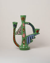 Suzanne Sullivan Bare Essential Meaning Candlestick on light color background.