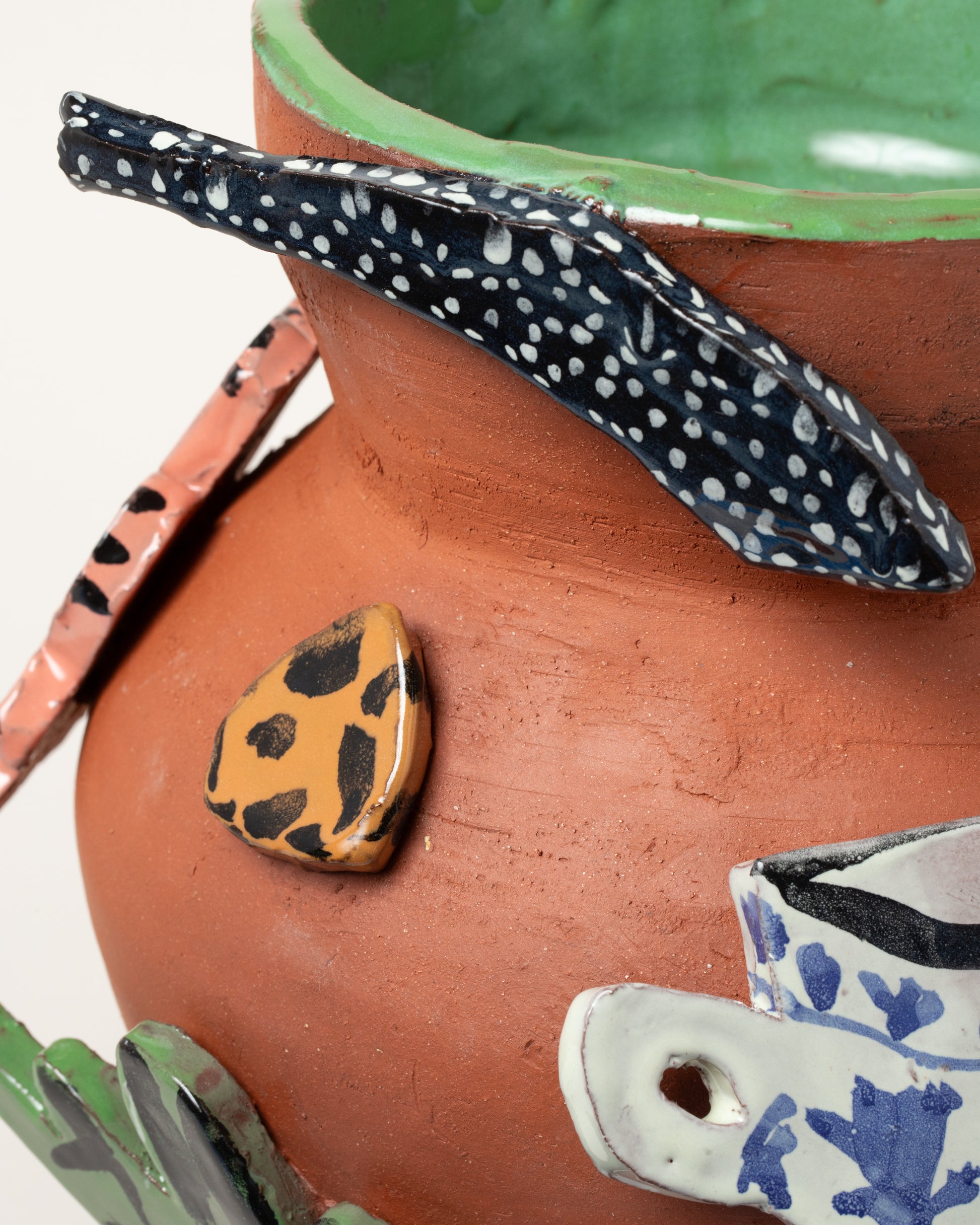 Closeup details of the Maggie Boyd Large Cut Out Vase on light color background.