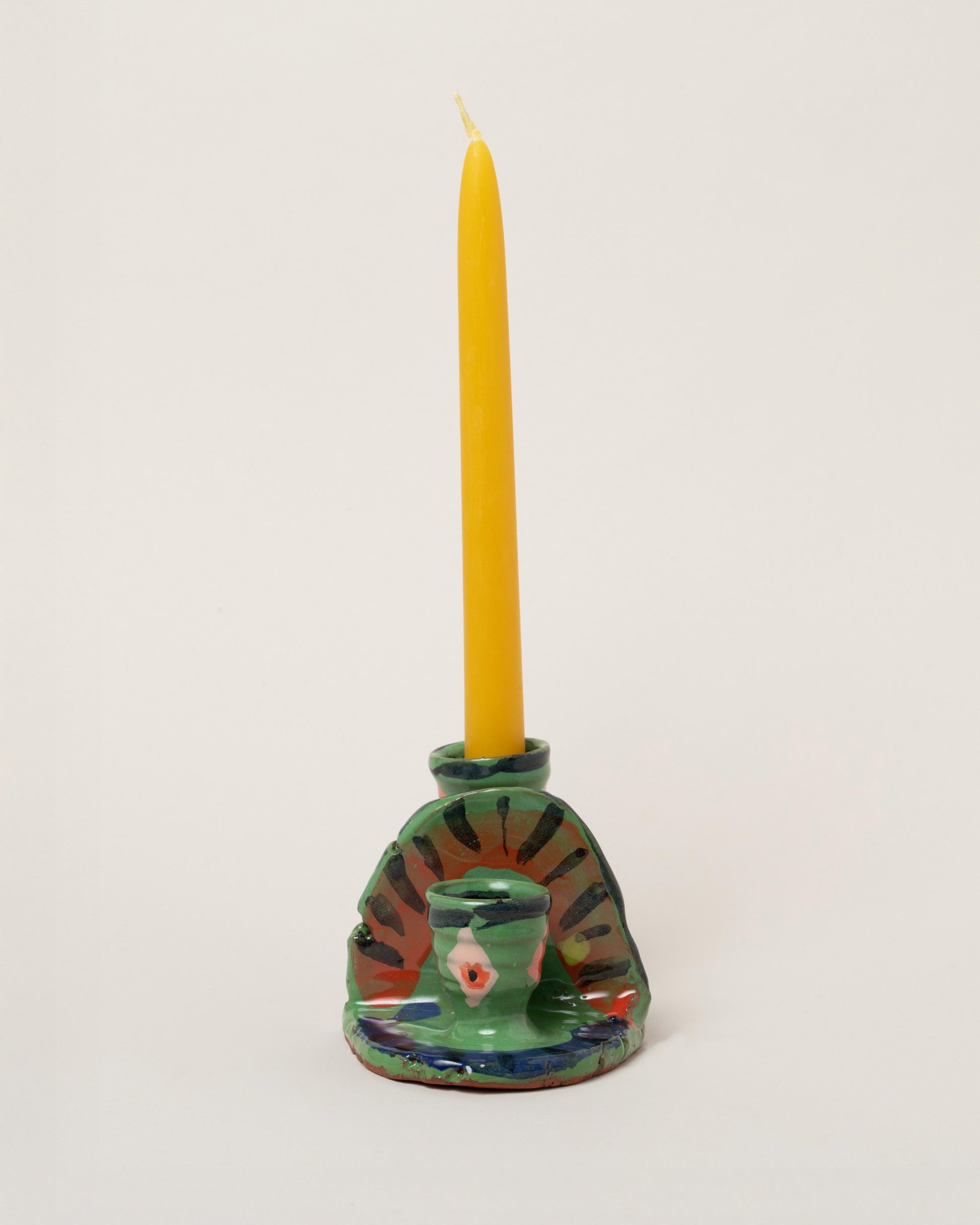Maggie Boyd Small Green Candle Holder on light color background.