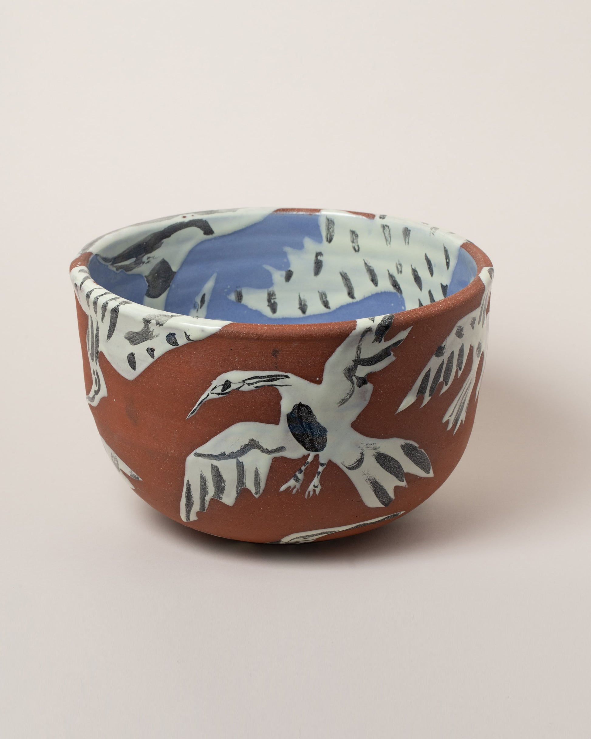 Maggie Boyd Birds Salad Bowl on light color background.