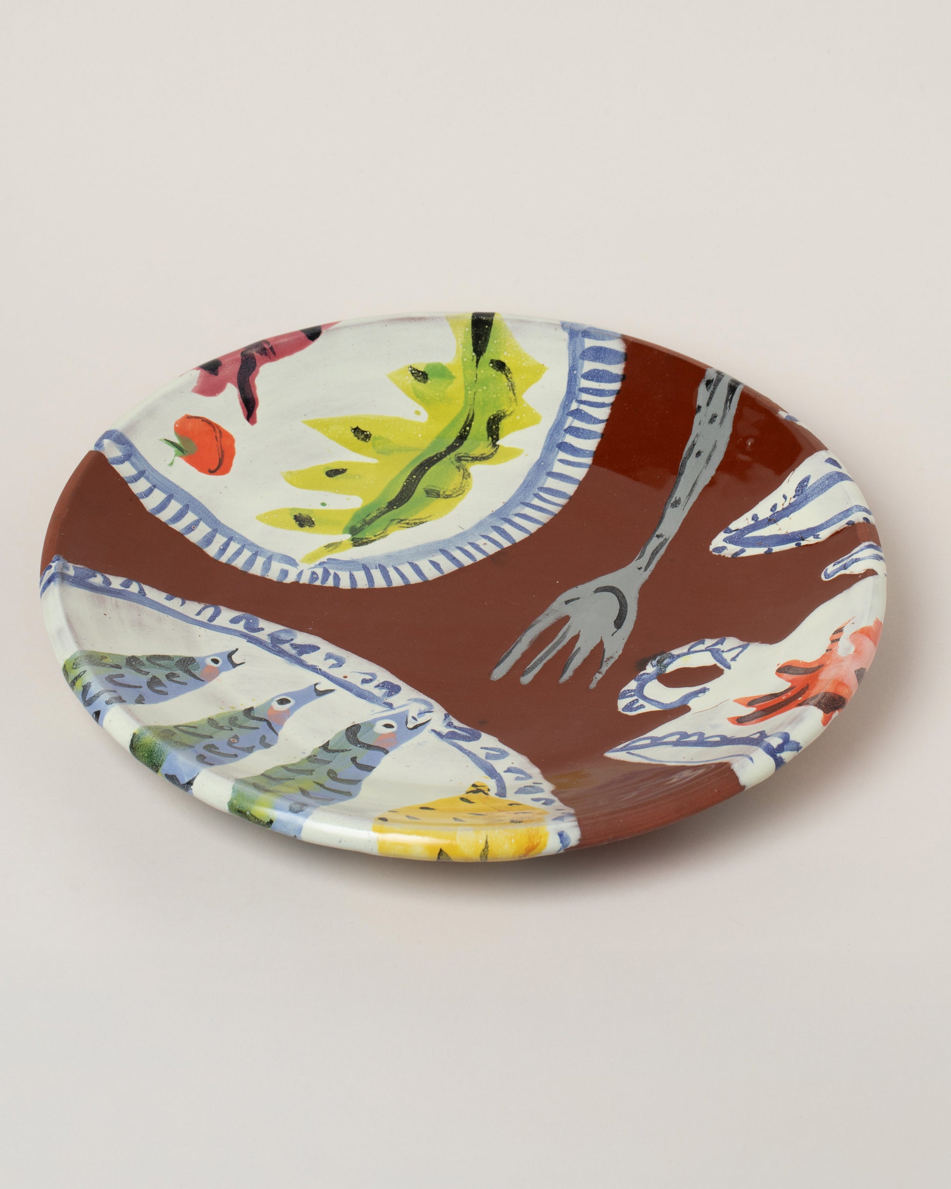 Maggie Boyd Brown Anchovy Platter on light color background.