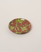 Maggie Boyd Chartreuse Two Clay Flower Side Plate on light color background.