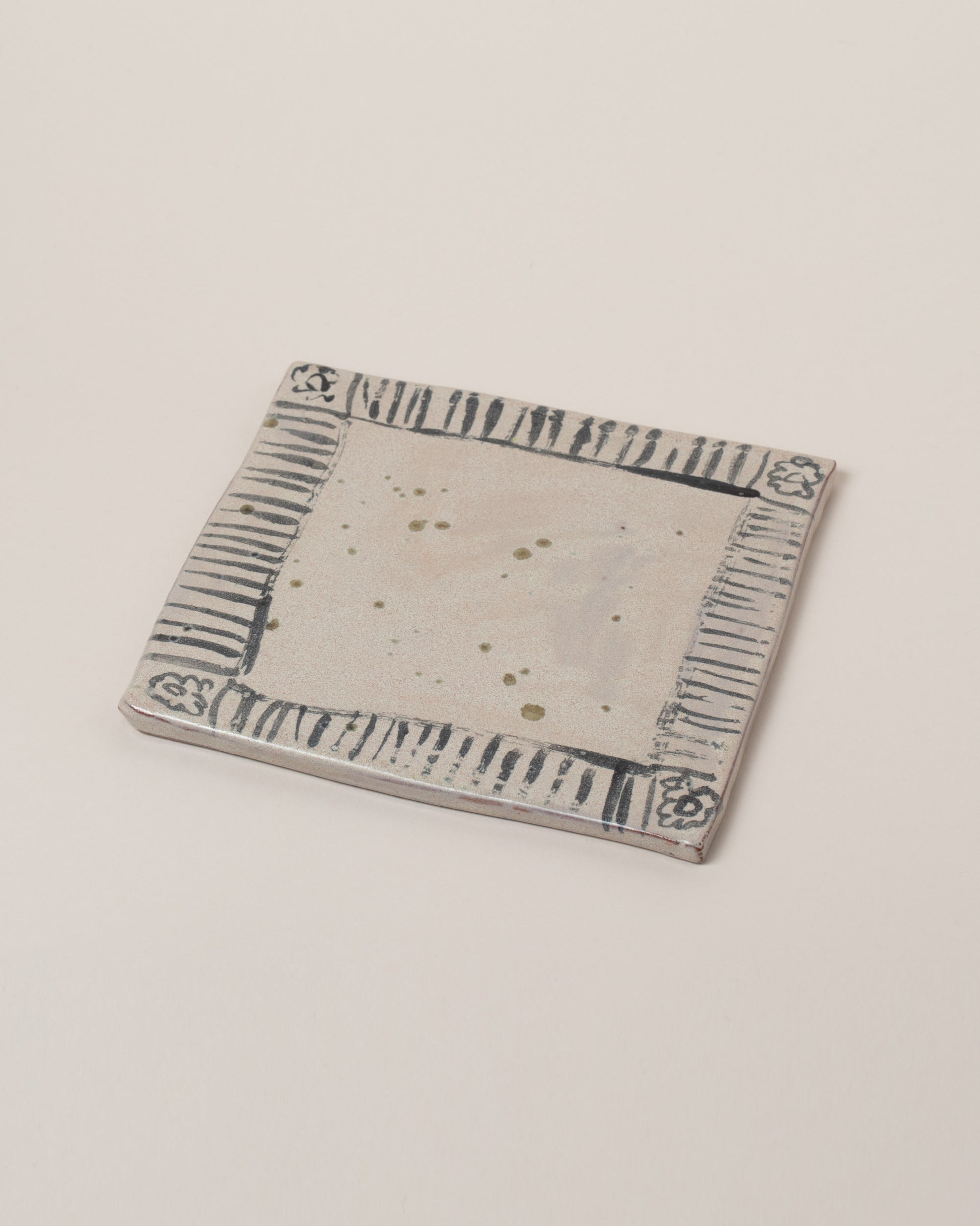 Maggie Boyd "Napkin" trivet on light color background.