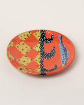 Maggie Boyd Red Hot Large Fish Plate on light color background.