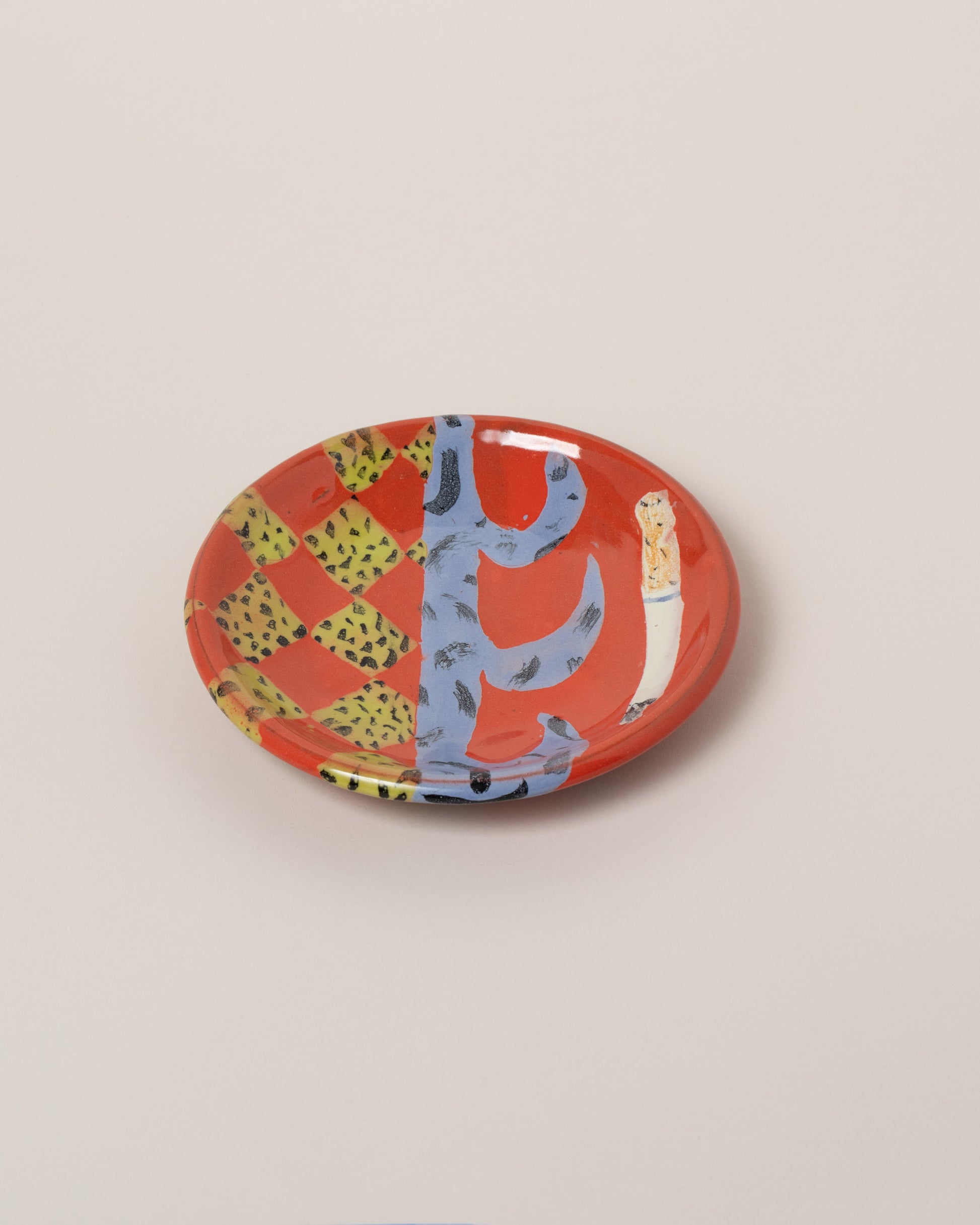 Maggie Boyd Three Red Hot Small Side Plate on light color background.