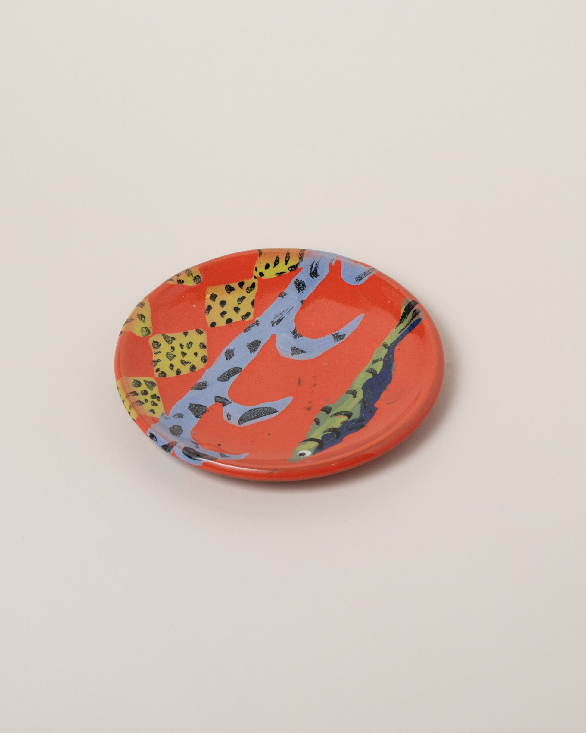 Maggie Boyd Four Red Hot Small Side Plate on light color background.