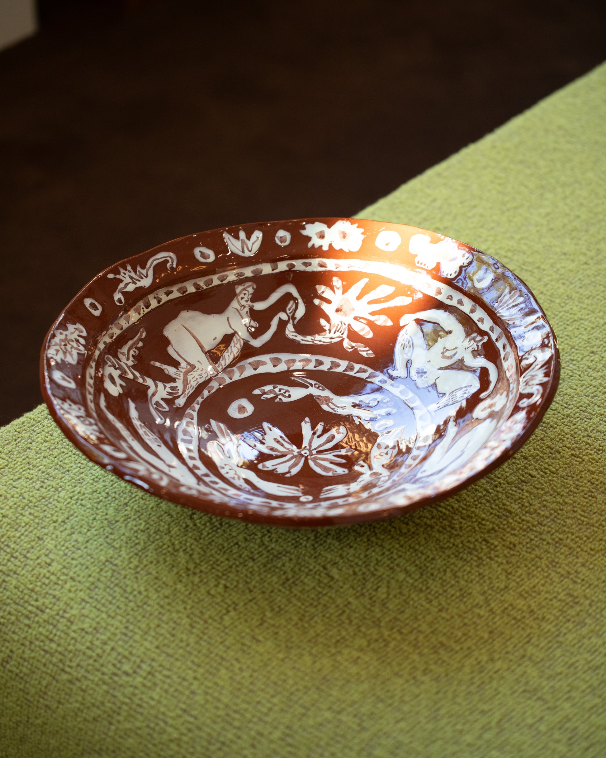 Detail view of the Maggie Boyd Extra Large Chocolate Flower Lickers Bowl.