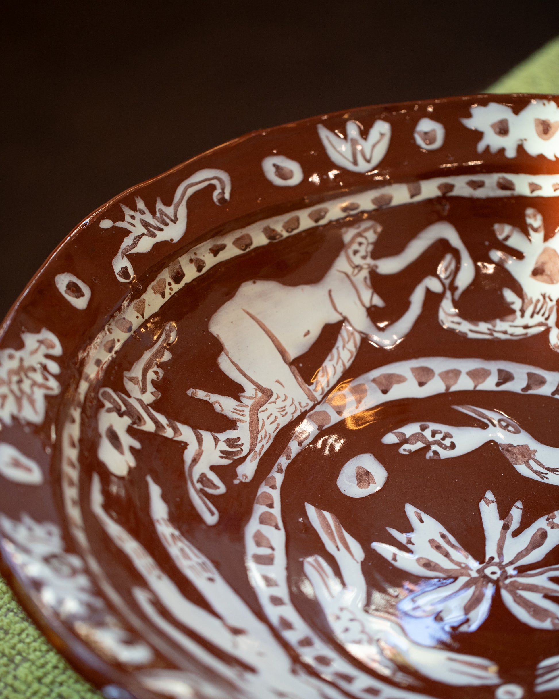 Closeup details of the Maggie Boyd Extra Large Chocolate Flower Lickers Bowl.