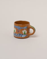 Maggie Boyd Ambrosia Fish & Flower Mug on light color background.