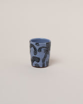 Maggie Boyd Blue One Black Flower Tumbler on light color background.