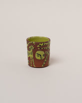 Maggie Boyd One Chartreuse & Black Figure Tumbler on light color background.