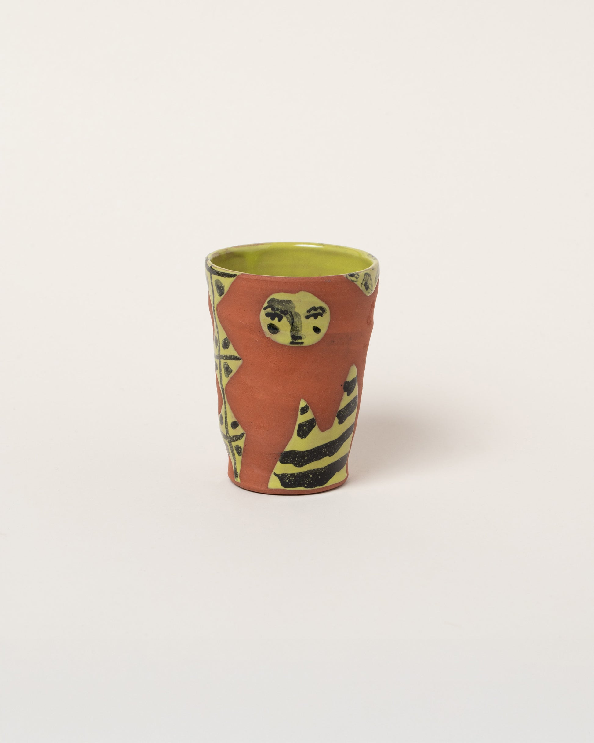 Maggie Boyd Three Chartreuse & Black Figure Tumbler on light color background.