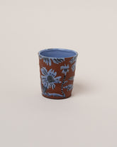 Maggie Boyd Blue One Clay Flower Tumbler on light color background.