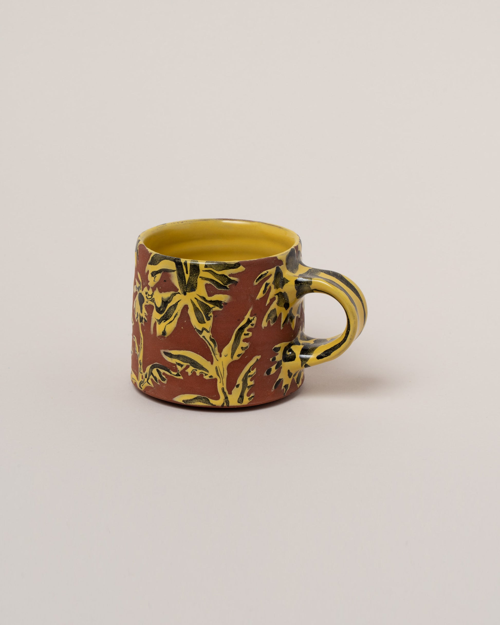 Maggie Boyd Golden Rod Flower Mug on light color background.