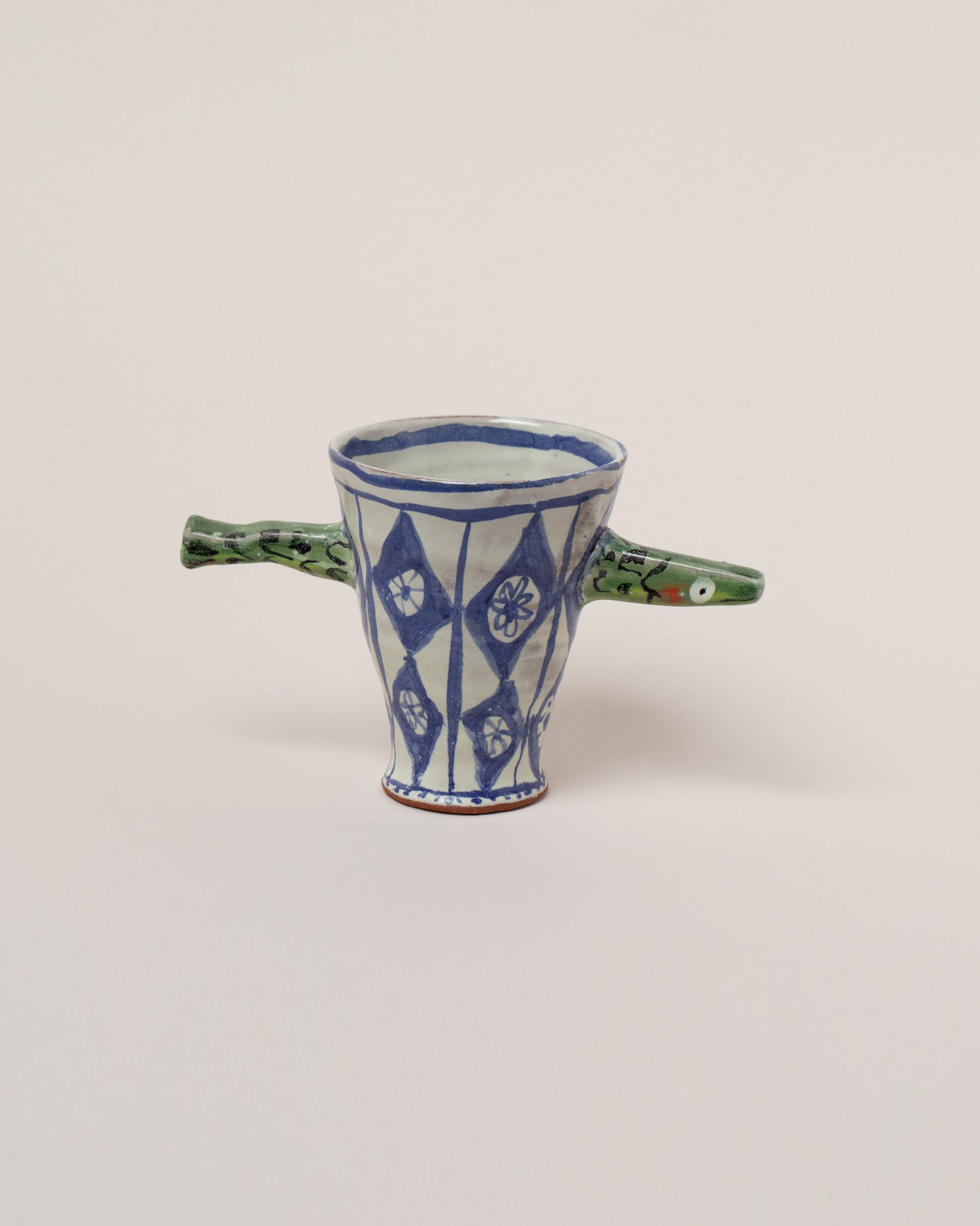 Maggie Boyd One Green Sardine Cup on light color background.