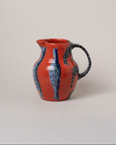 Maggie Boyd Red Hot Sardine Pitcher on light color background.