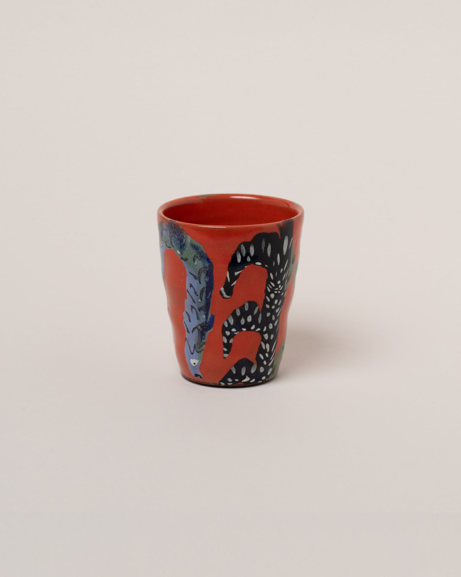 Maggie Boyd Red Jester Fish Tumbler on light color background.
