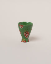 Maggie Boyd One Strawberry Tumbler on light color background.