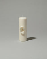 Bonam Kim Ear Pillar Candle on light color background.