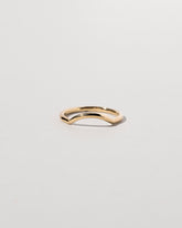 Gold Solid Round Wire Mini Curve Band on light color background.