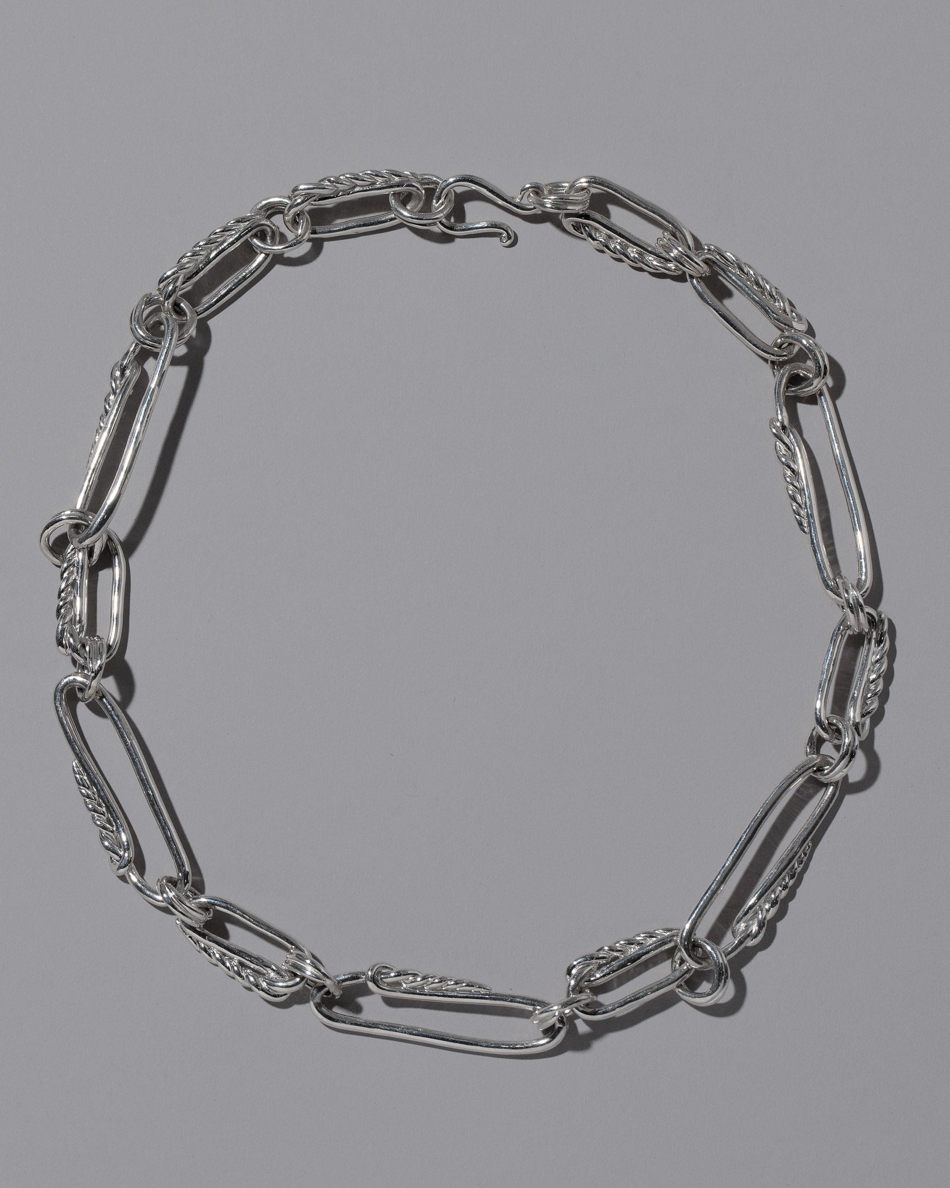 CRZM Sterling Silver Ophiolite Necklace on light color background.