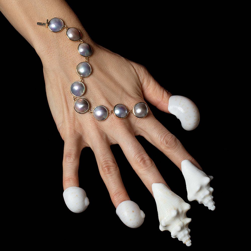 product_details::Loon Mabe Pearl Bracelet on light color background.