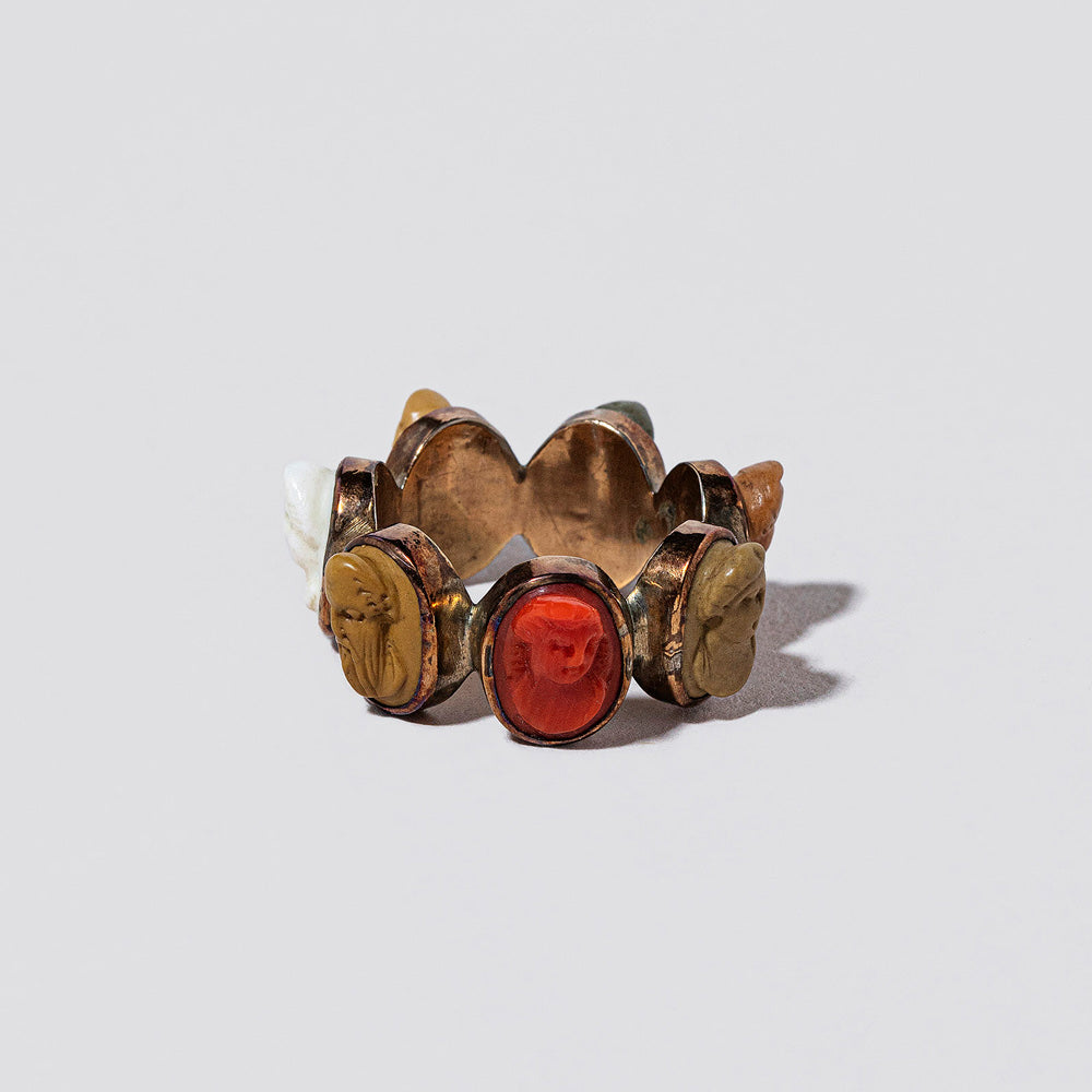 product_details::Closeup details of the Antique Days of the Week Ring on light color background.