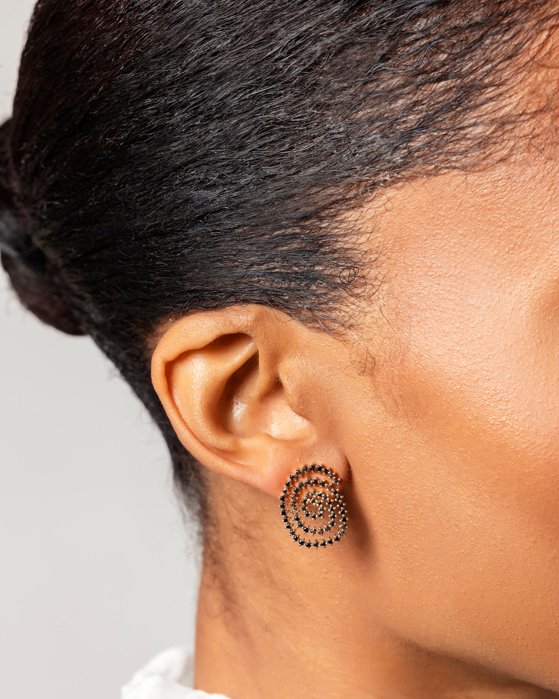 Right Black Diamond Cycle of Rebirth Earring Single worn on on model.