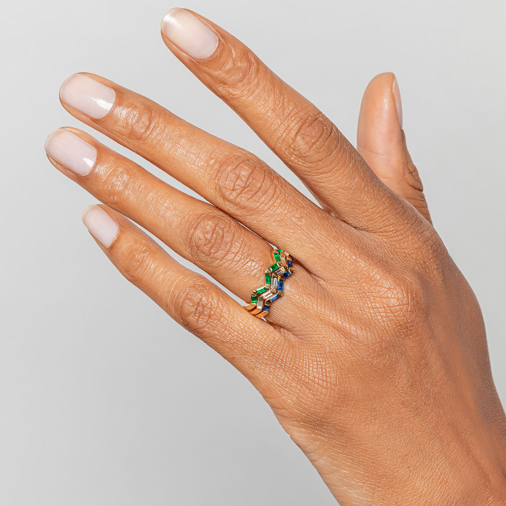 product_details::Emerald, Sapphire and White Diamond Baguette Yellow Gold Zig Zag Bands on model.