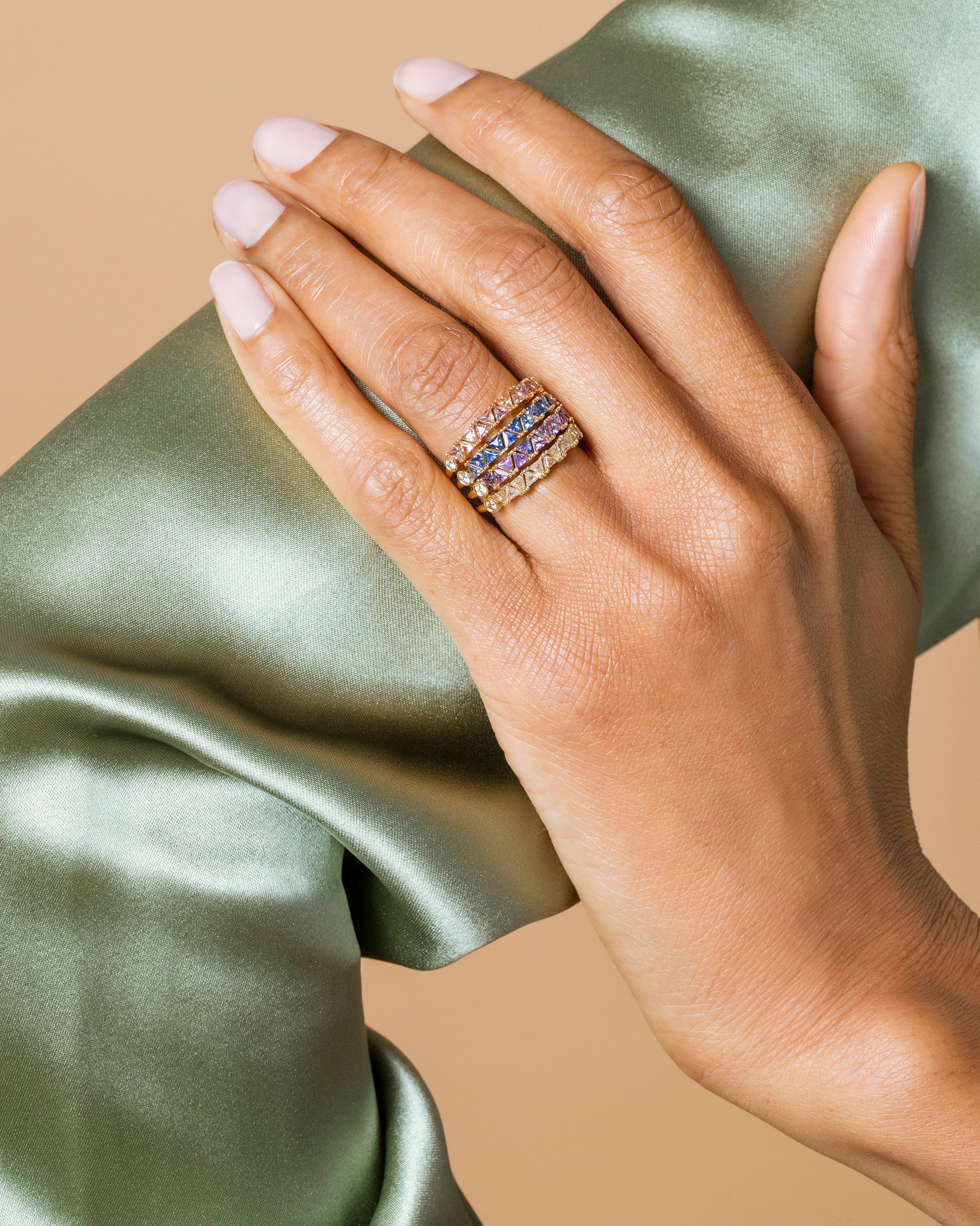 Blue Sapphire Eleven Trillion Ring, Lavender Sapphire Eleven Trillion Ring, Yellow Sapphire Eleven Trillion Ring and Peach Sapphire Eleven Trillion Rings on model.