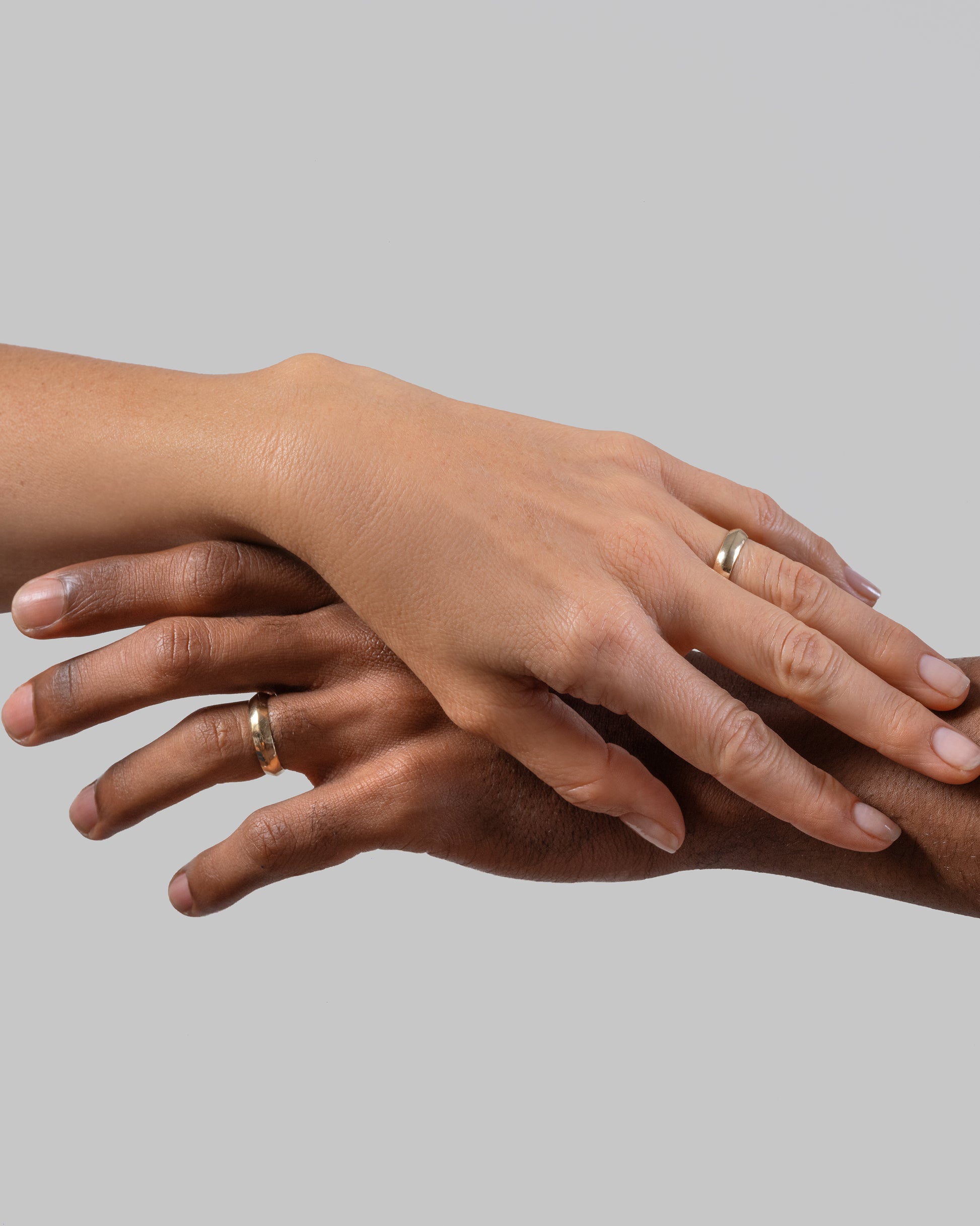 Gold 5mm Knife Edge Bands on models.