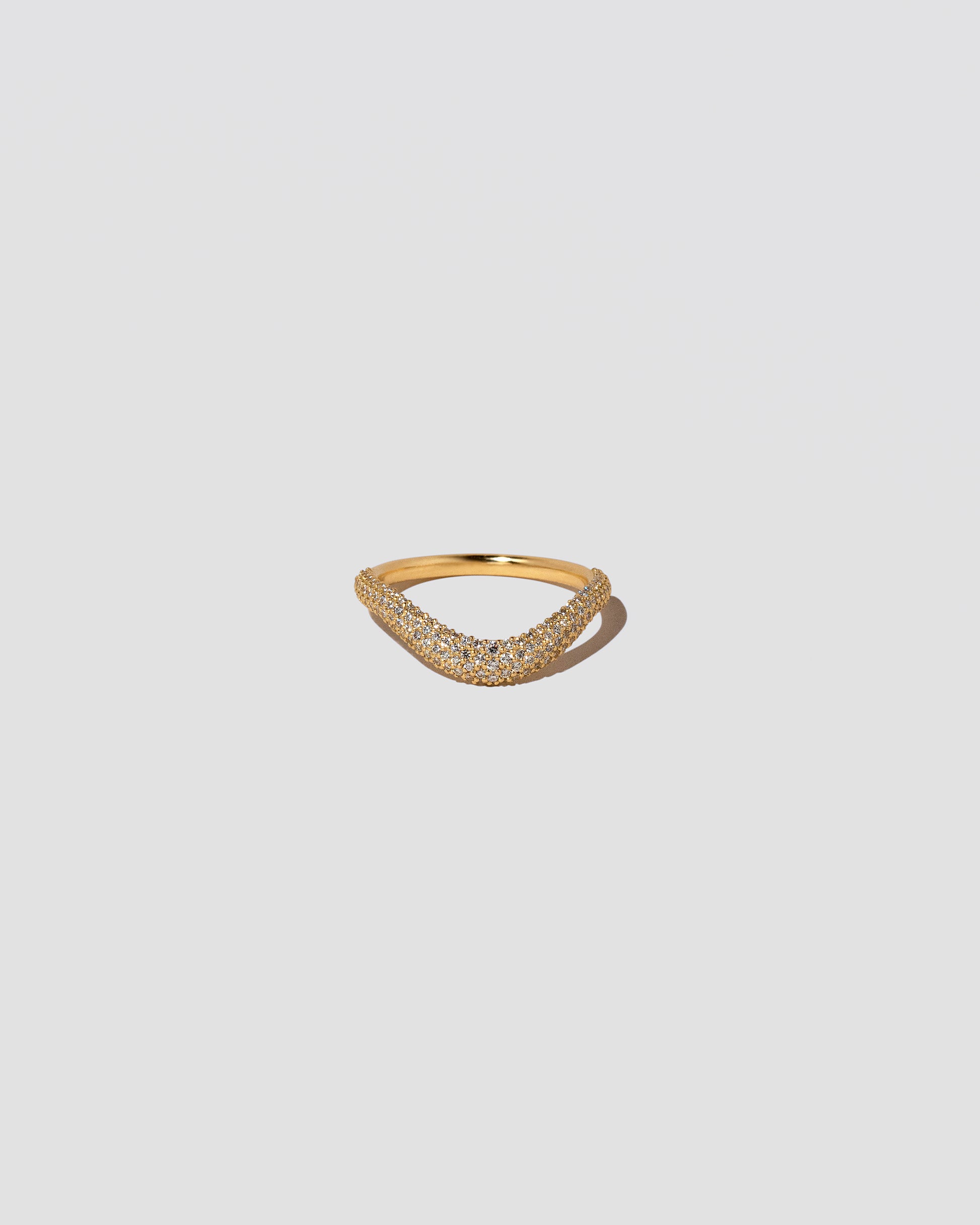Gold Pavé Thin Level Band on light color background.