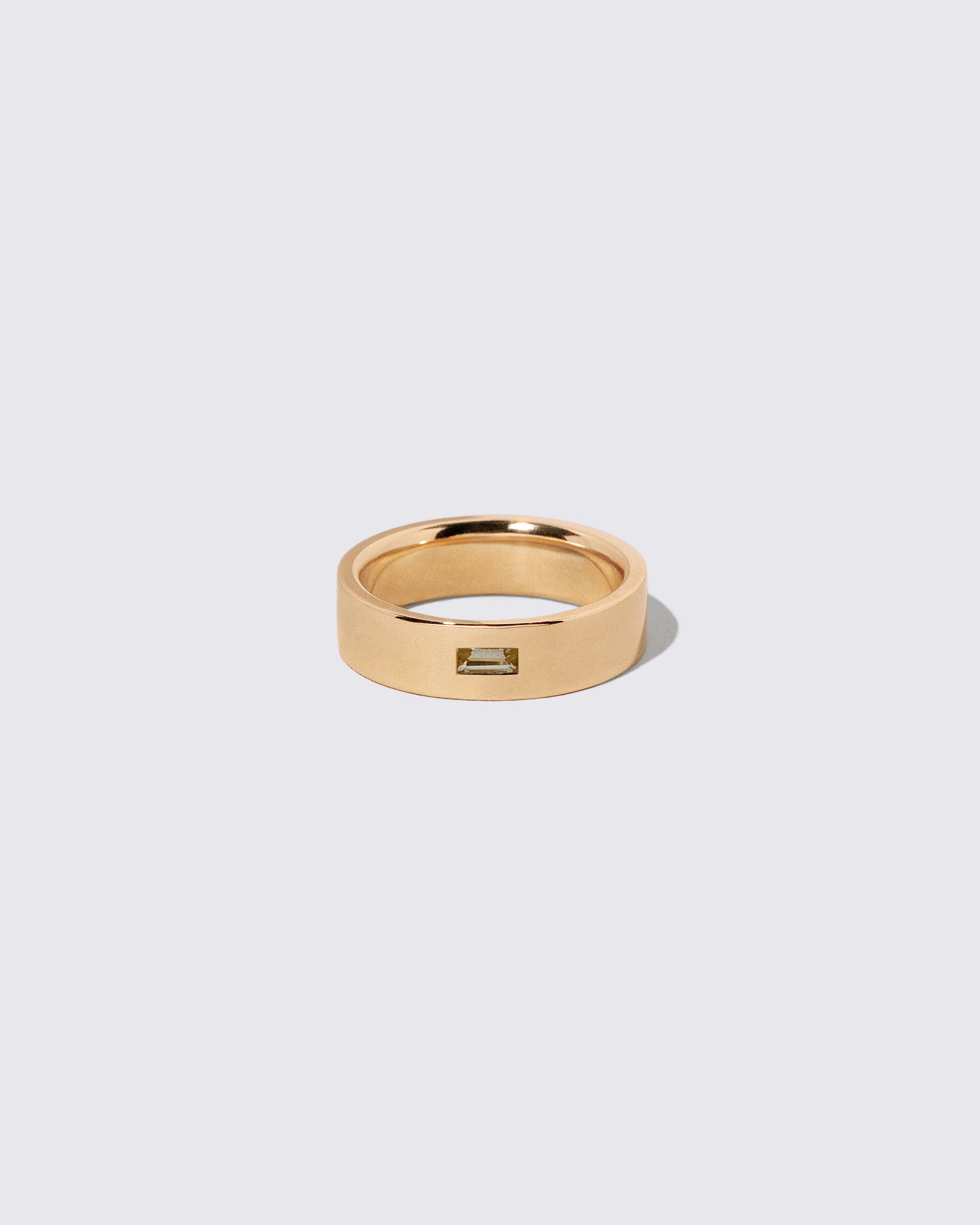 Gold Yellow Beryl East West 6mm Baguette-Set Piet Band on light color background.