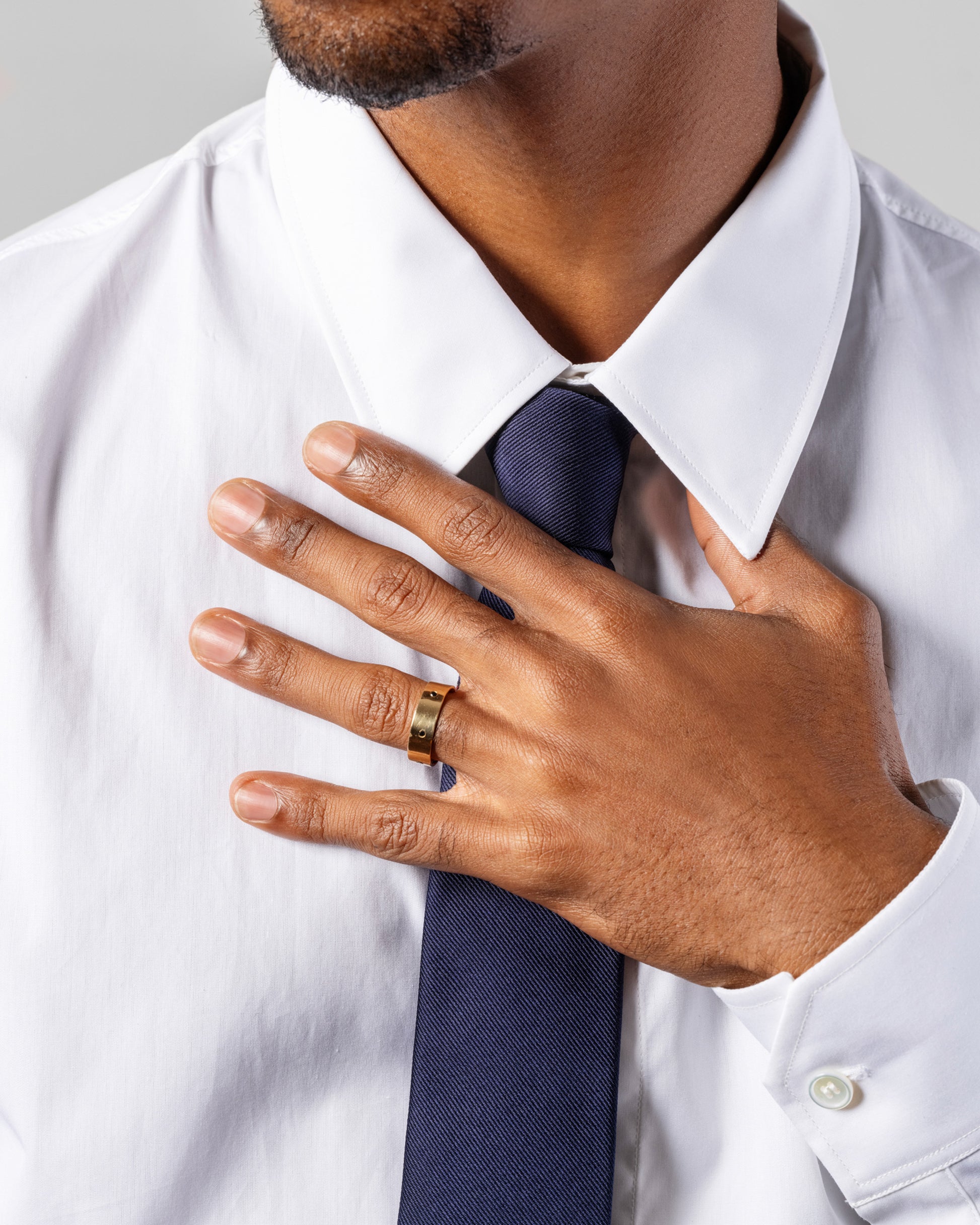 Gold 6mm Square Wire Band with Six 1.6mm Black Diamonds on male model.