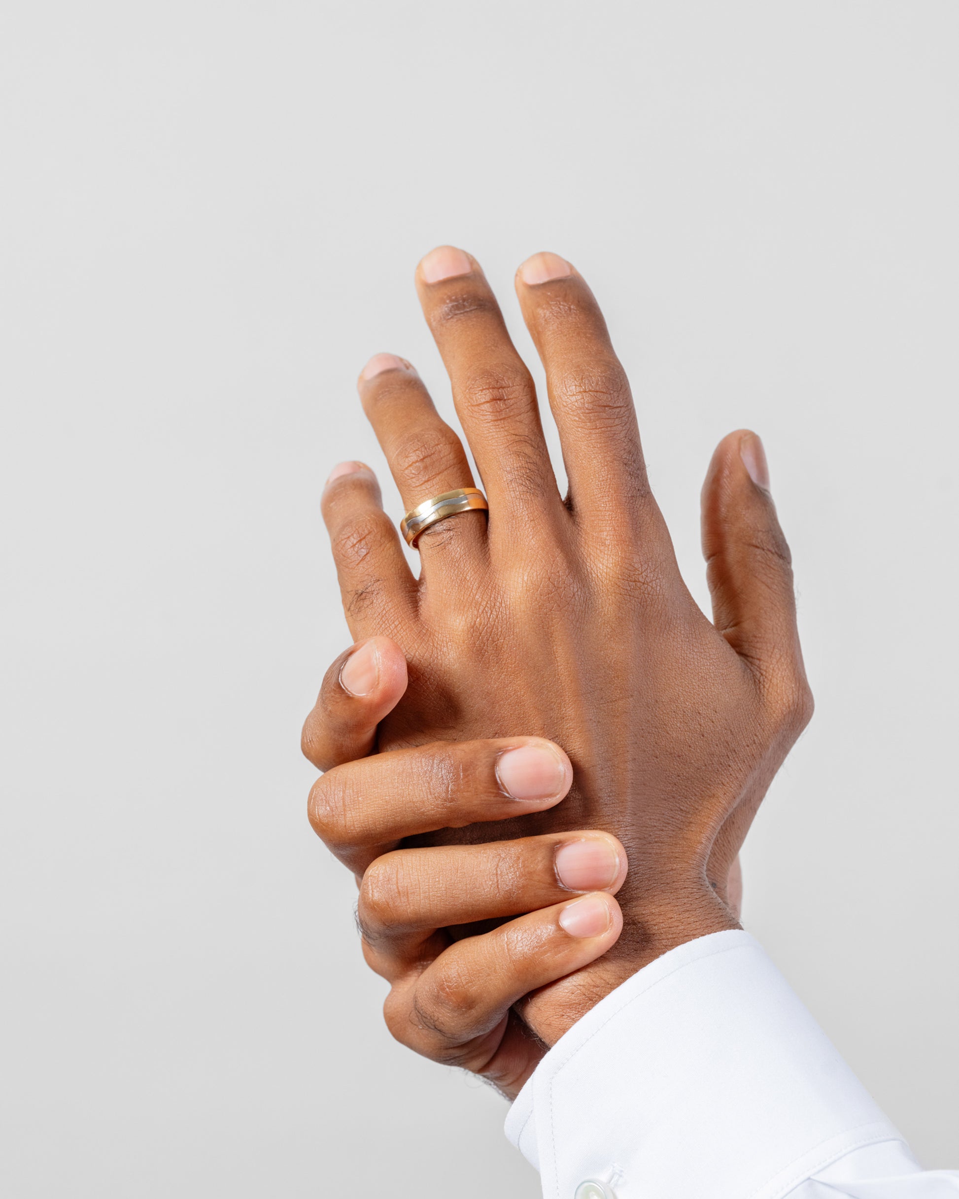 6mm 18K Outside and Platinum Inside Swimming Pool Band on male model.