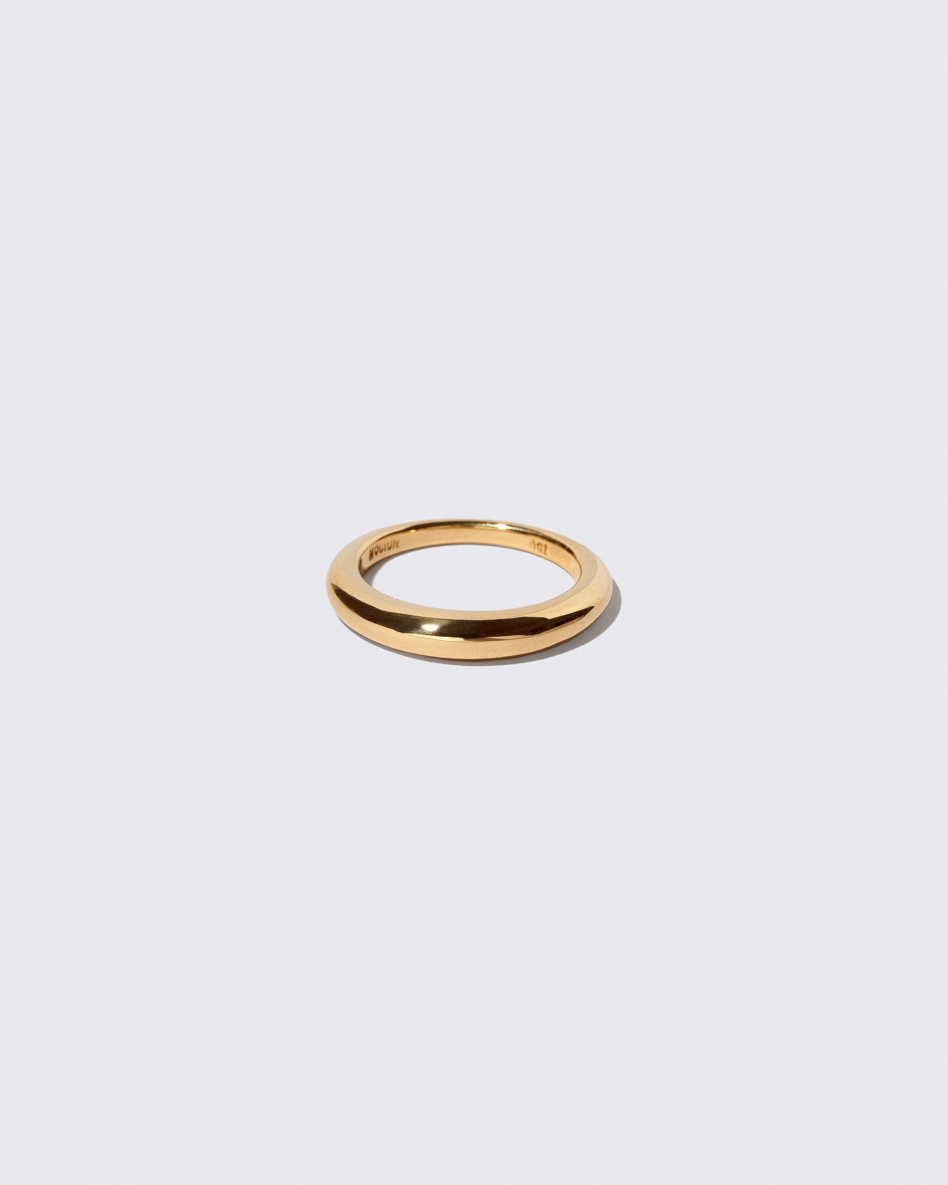 Gold 3.5mm Venus Band on light color background.