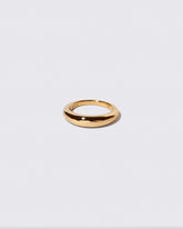 Gold 4.5mm Venus Band on light color background.