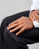 Gold 4.5mm Venus Band on male model.