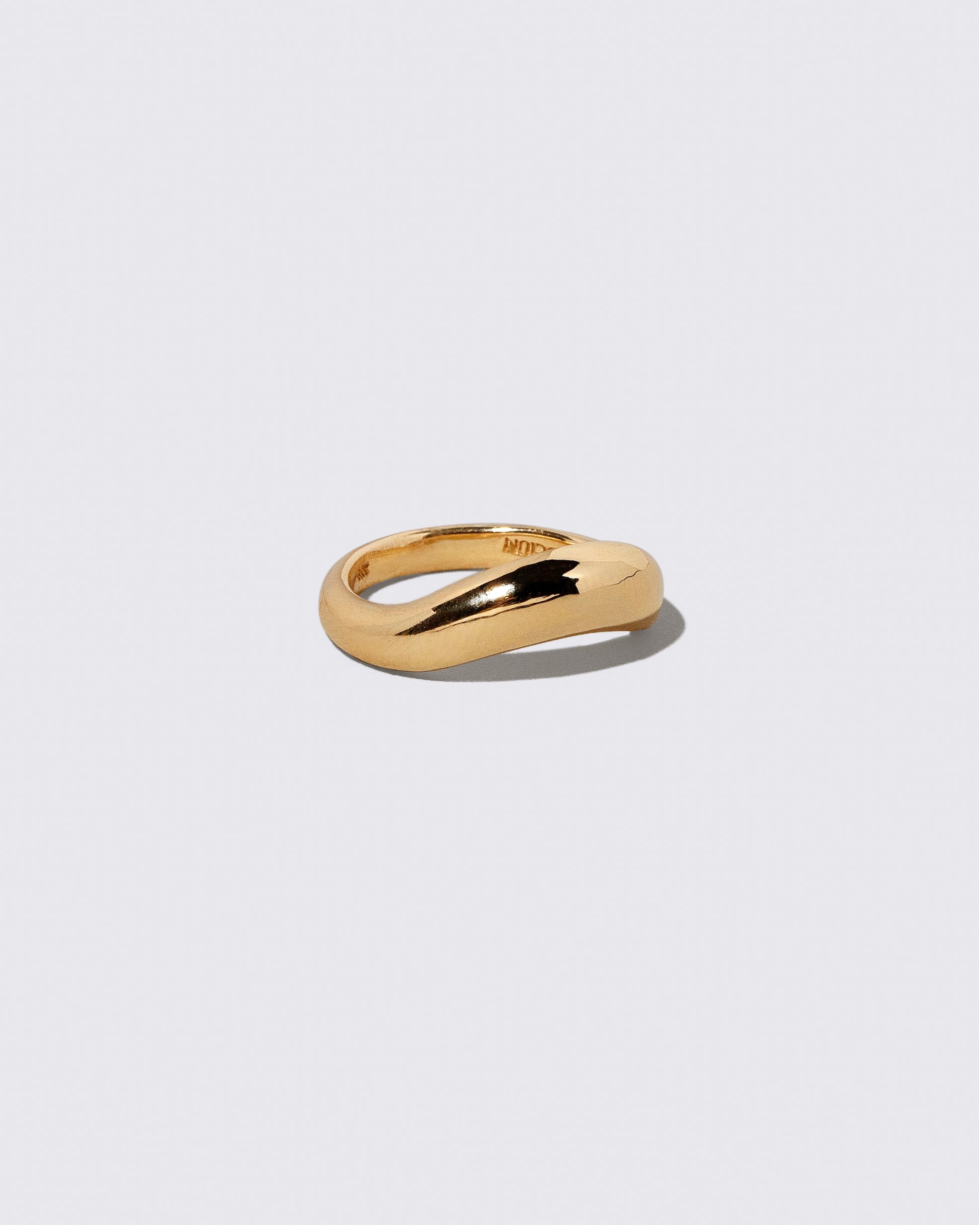 View from the side of the Gold Wide Level Band on light color background.